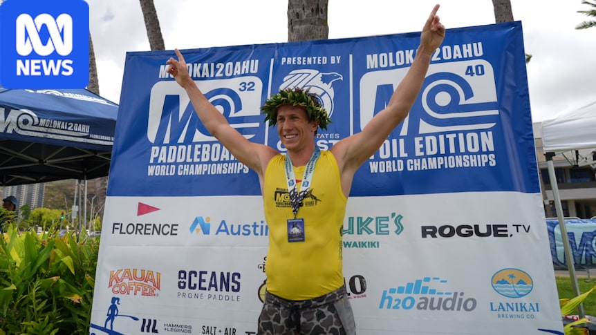 Man who rescued woman bitten by shark at Coogee Beach wins world paddleboard championship