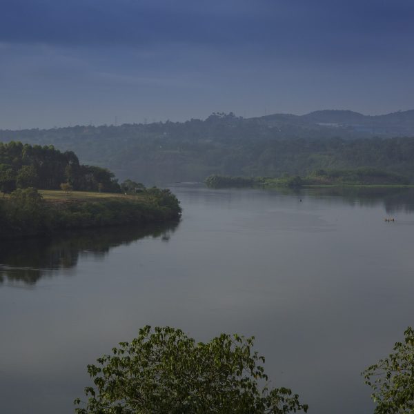 Sunscreen for Lakes and Dams: Could a Thin Floating Layer of Nanomaterial Shield Water from Evaporation?