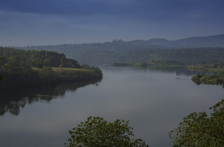 Sunscreen for Lakes and Dams: Could a Thin Floating Layer of Nanomaterial Shield Water from Evaporation?